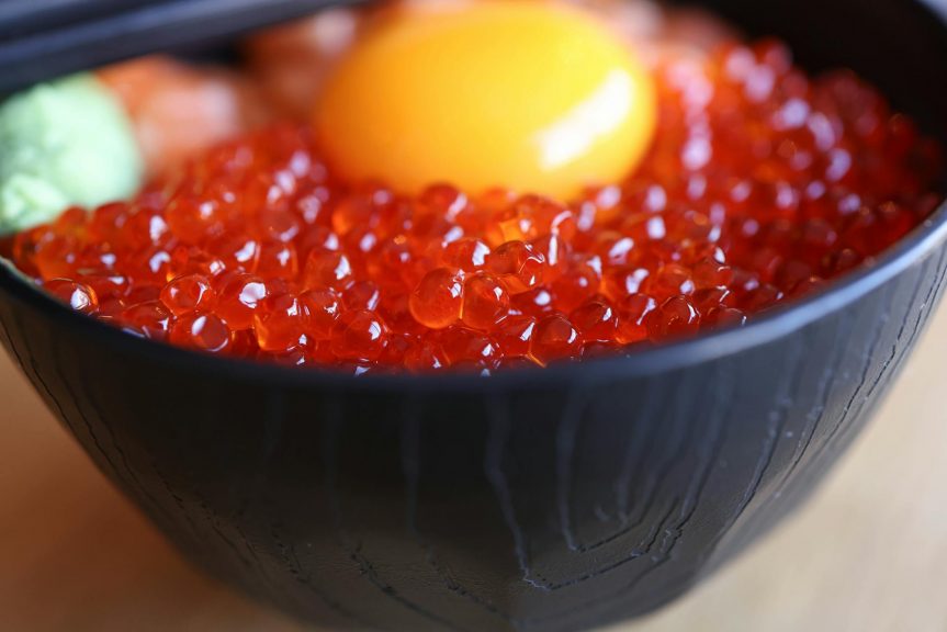 A bowl of ikura salmon roe in a Japanese restaurant